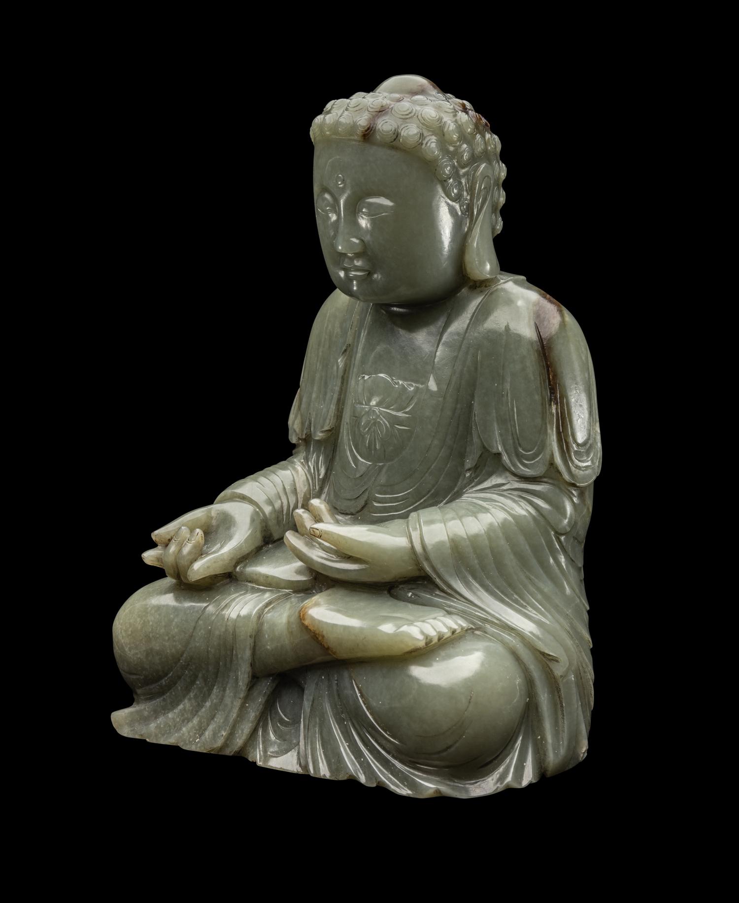 A Chinese Celadon Jade Figure of Medicine Buddha
