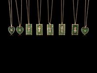 Eight Chinese Gilt Metal and Spinach Jade Necklaces
