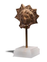 A Greek Terracotta Head of Helios