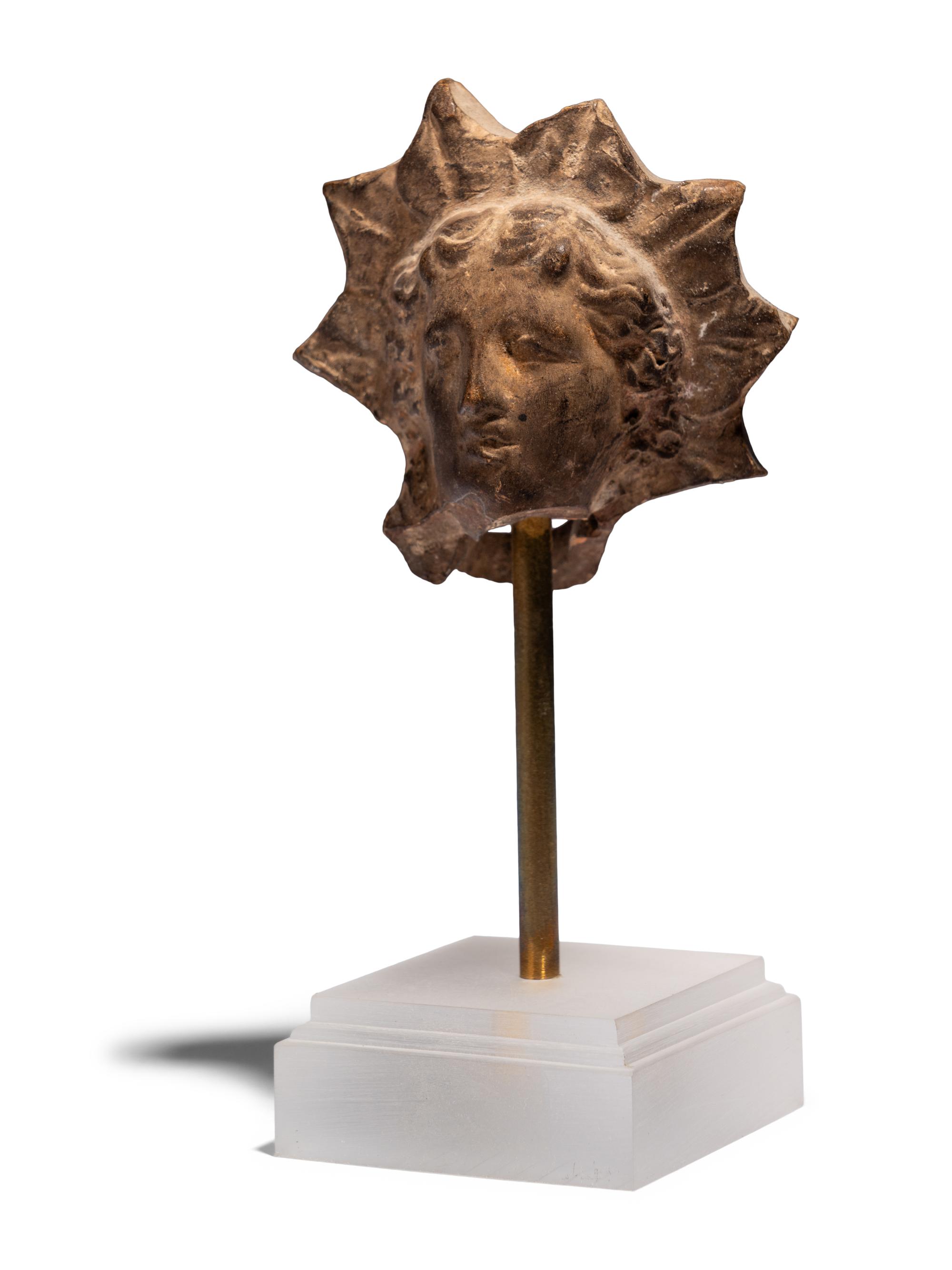 A Greek Terracotta Head of Helios
