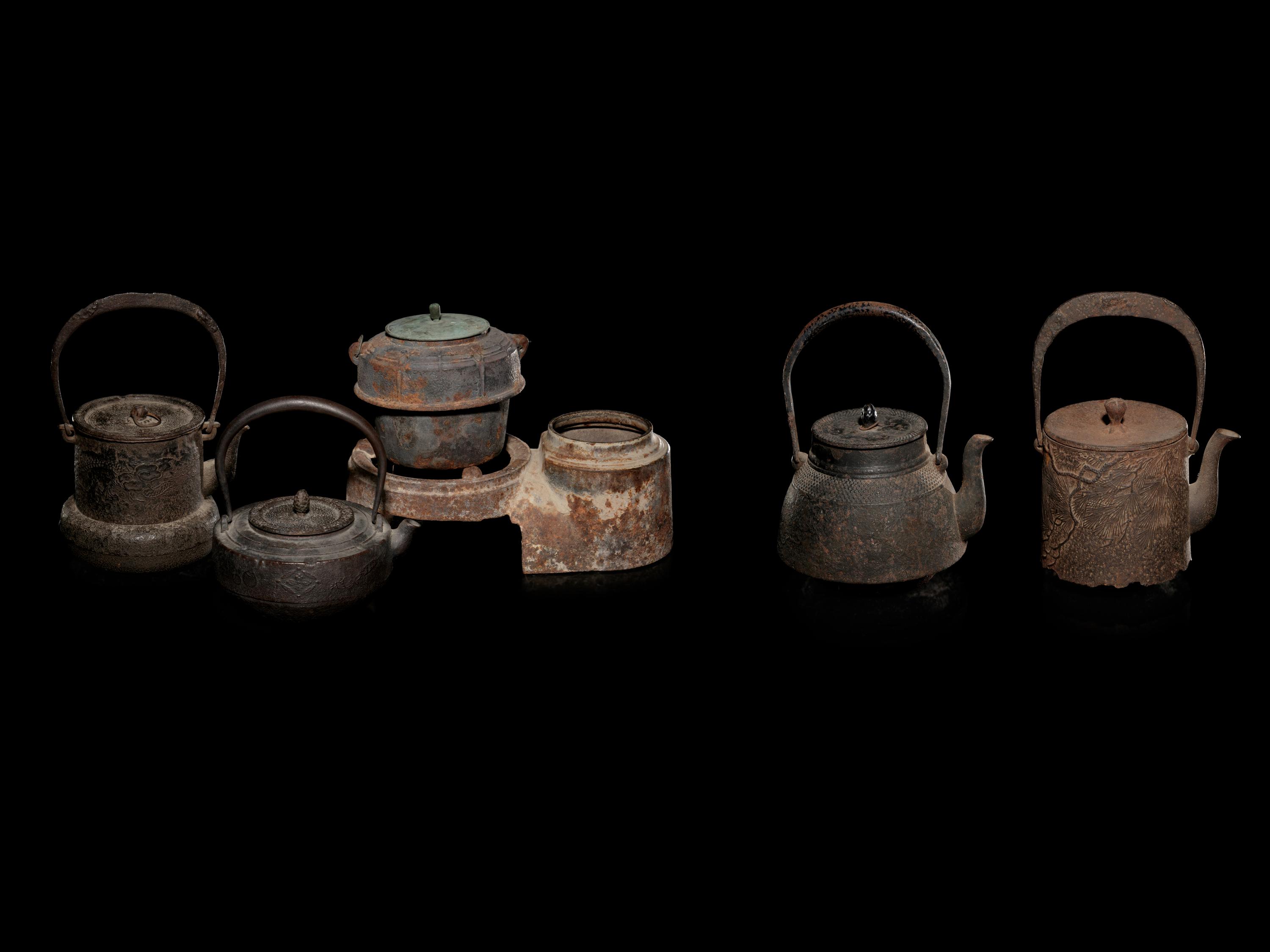 Five Japanese Cast Iron Teapots, Tetsubin , and Burner