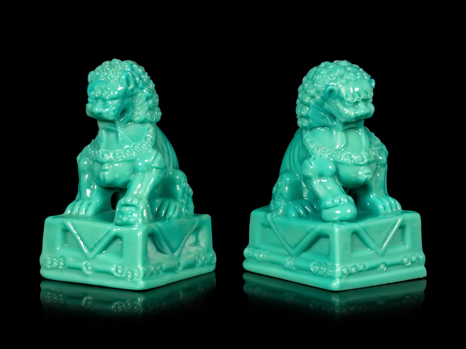 A Pair of Chinese Molded Glass Figures of Fu Lions