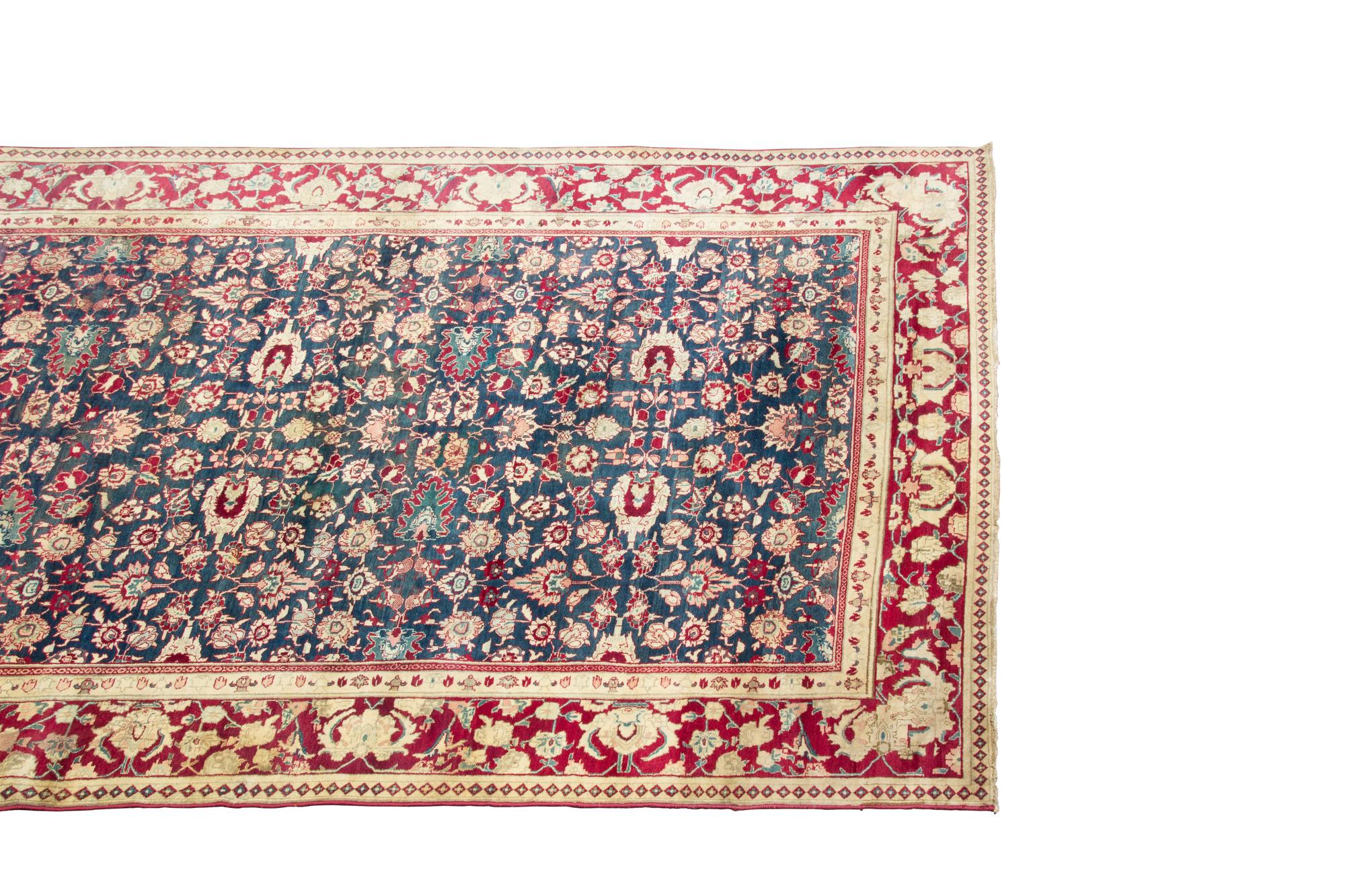 An Agra Gallery Carpet 12 feet x 5 feet. — 20TH CENTURY