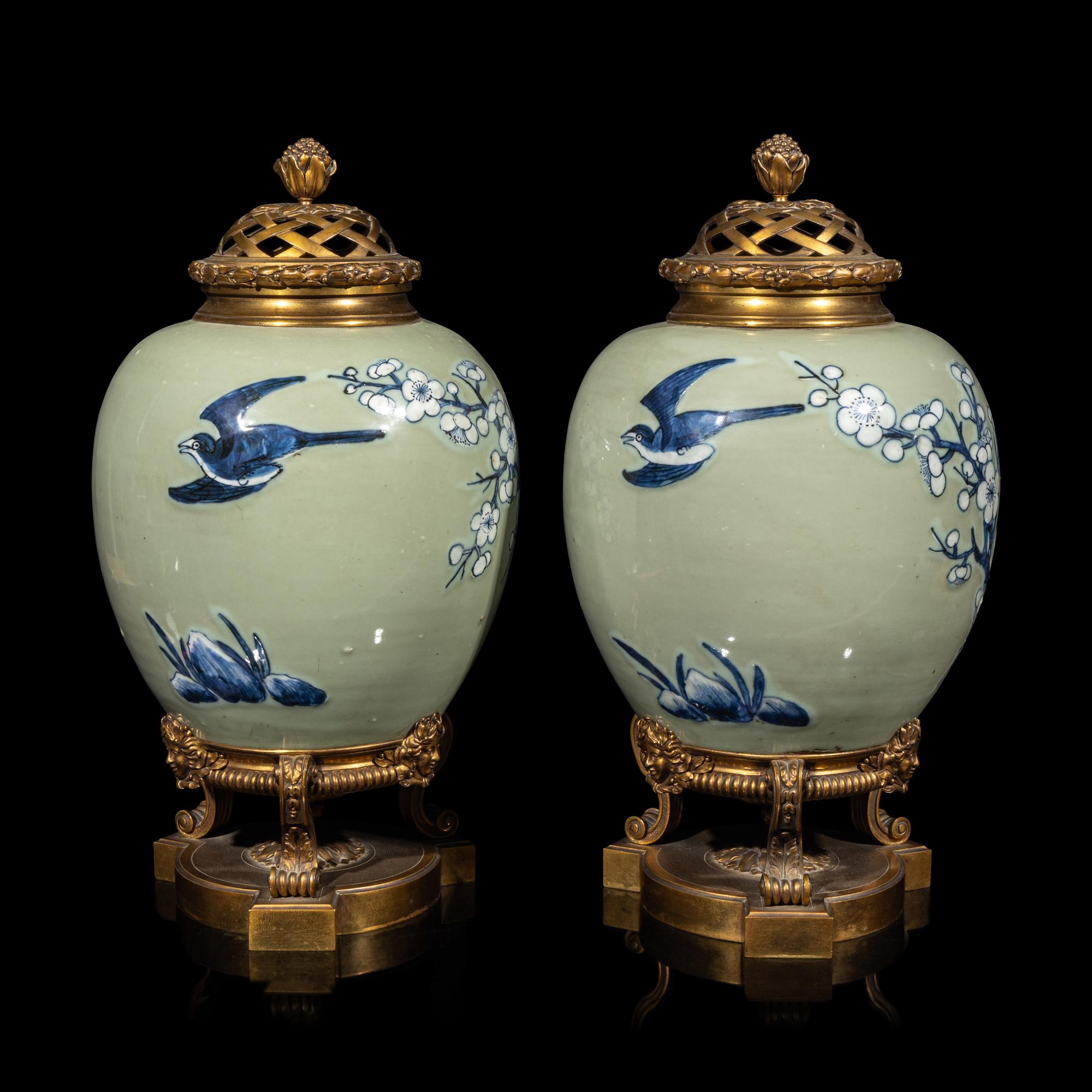 A Pair of Chinese Celadon Ground Blue and White Porcelain Jars with Later Ormolu Mounts, Porcelain: Kangxi Period, Mounts: Late 19th/Early 20th Century 銅鎏金鑲清康熙豆青地青花喜上眉梢圖罐一對