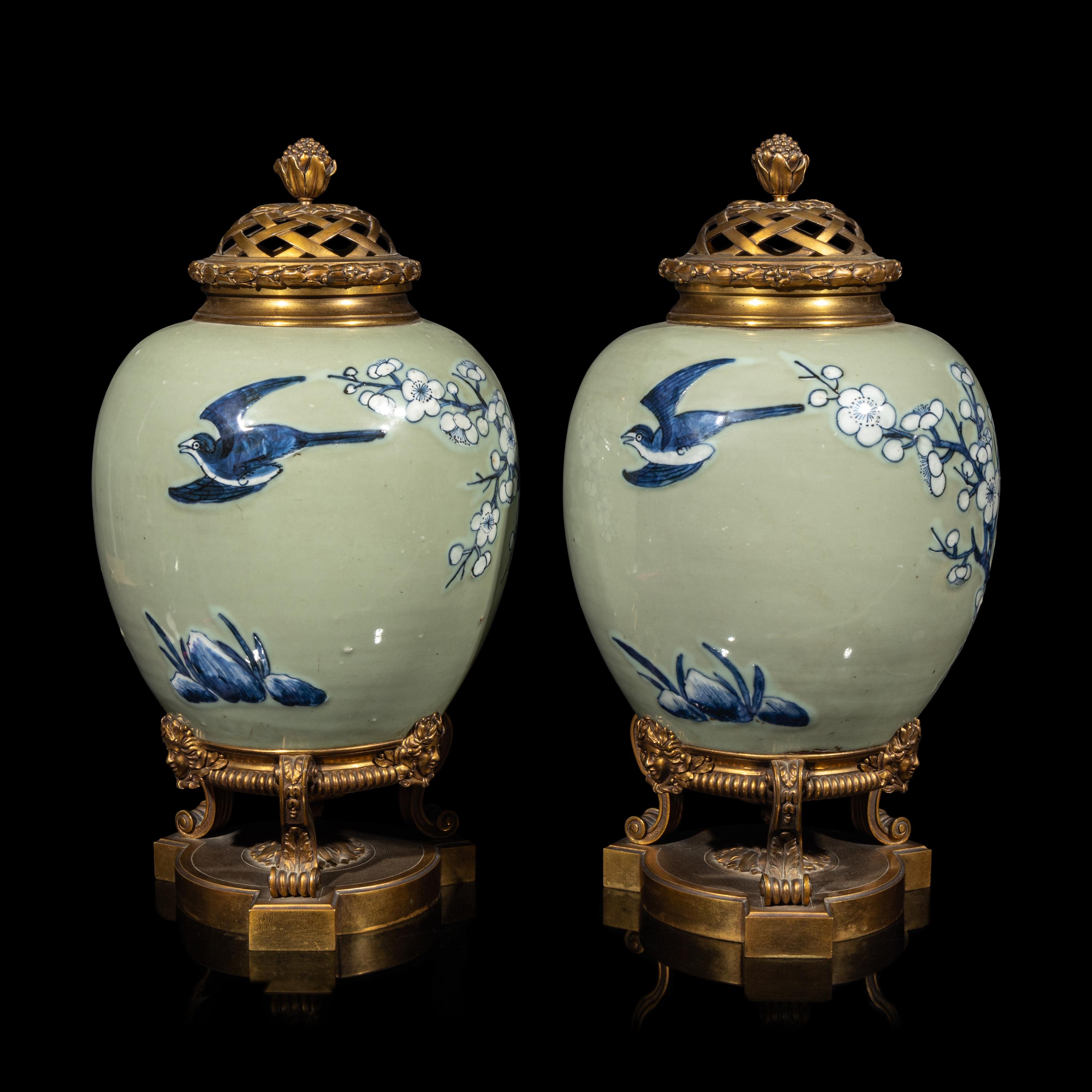 A Pair of Chinese Celadon Ground Blue and White Porcelain Jars with Later Ormolu Mounts, Porcelain: Kangxi Period, Mounts: Late 19th/Early 20th Century 銅鎏金鑲清康熙豆青地青花喜上眉梢圖罐一對