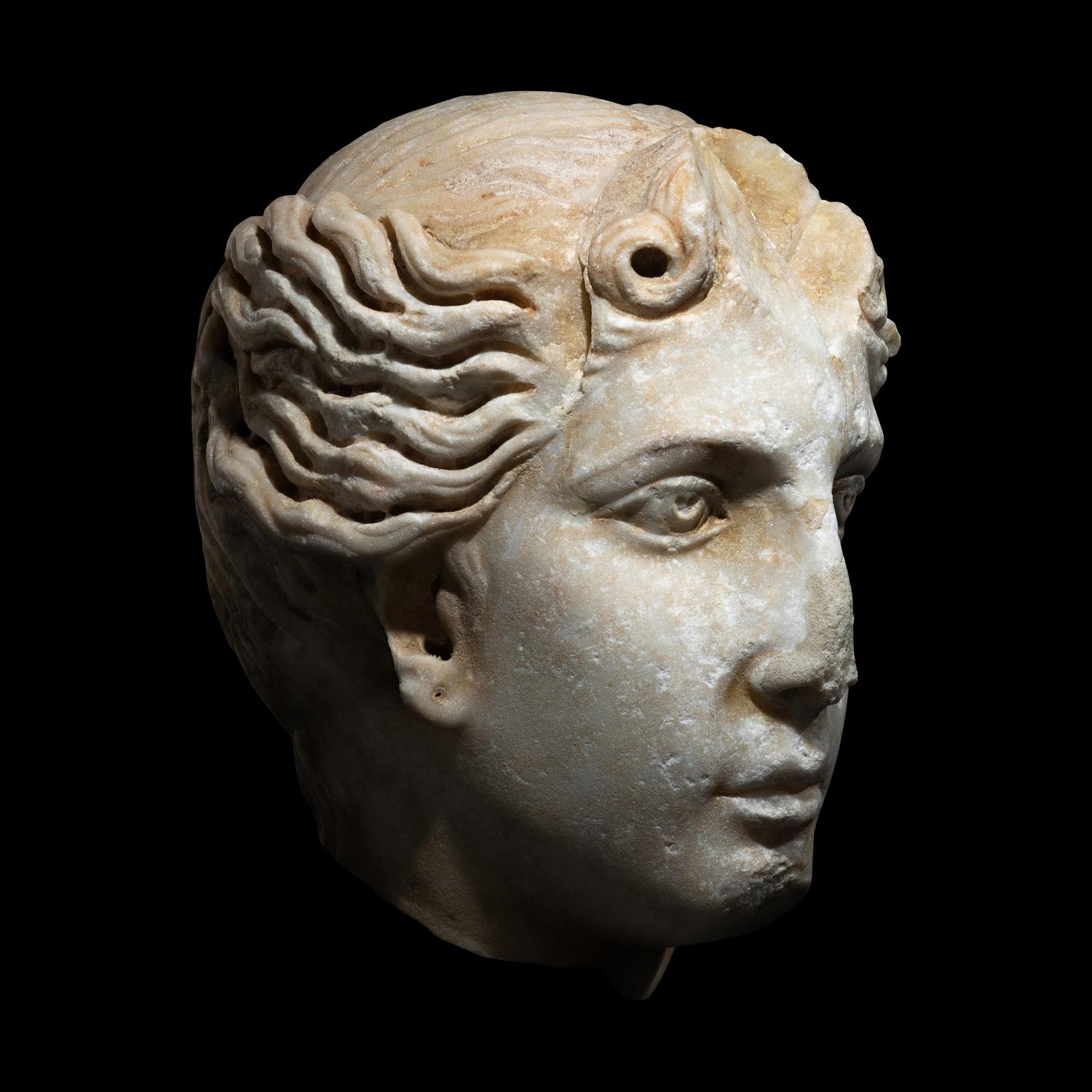 A Roman Marble Head of a Goddess