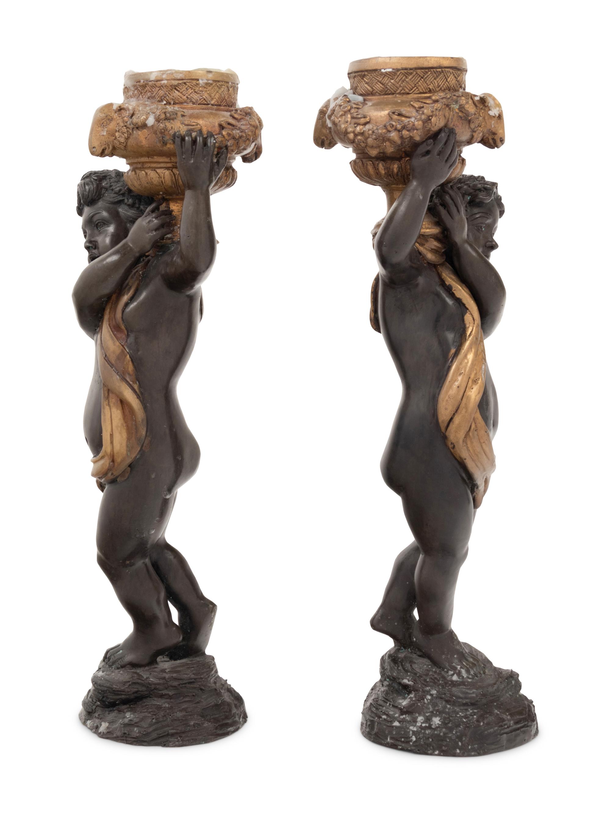 A Pair of Gilt and Patinated Bronze Figures of Cherubs