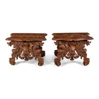 A Pair of Italian Carved Walnut Sgabello Stools