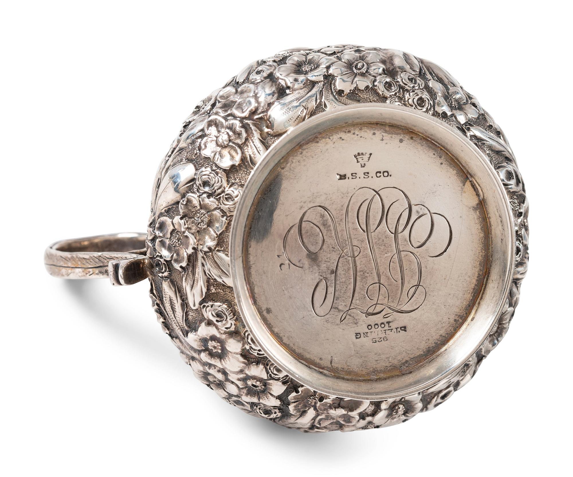 A Repousse Silver Three-Piece Tea Service