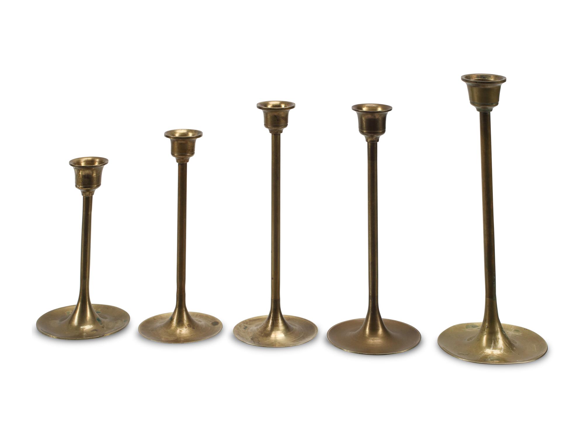 A Collection of Nineteen Brass Candlesticks
