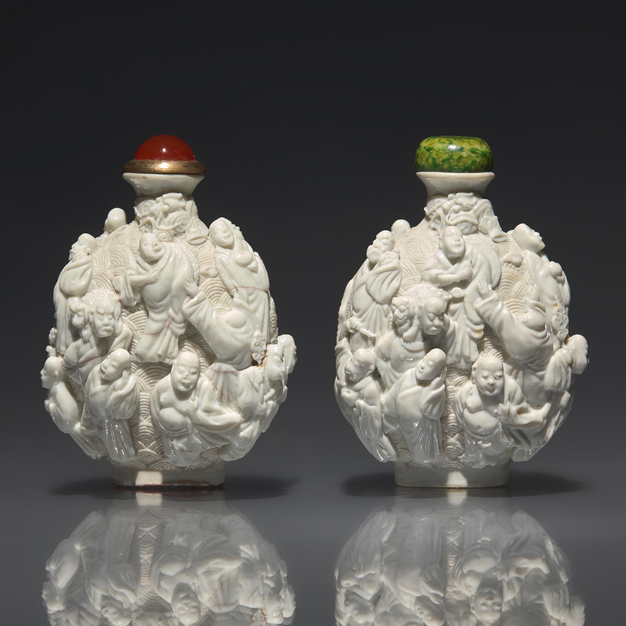 An Assembled Pair of Molded Porcelain "Lohan" Snuff Bottles, Qing Dynasty, Jiaqing Period — 清嘉慶 白釉瓷胎模製十八羅漢鼻煙壺兩支
