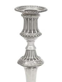 A Set of Three George III Silver Candlesticks