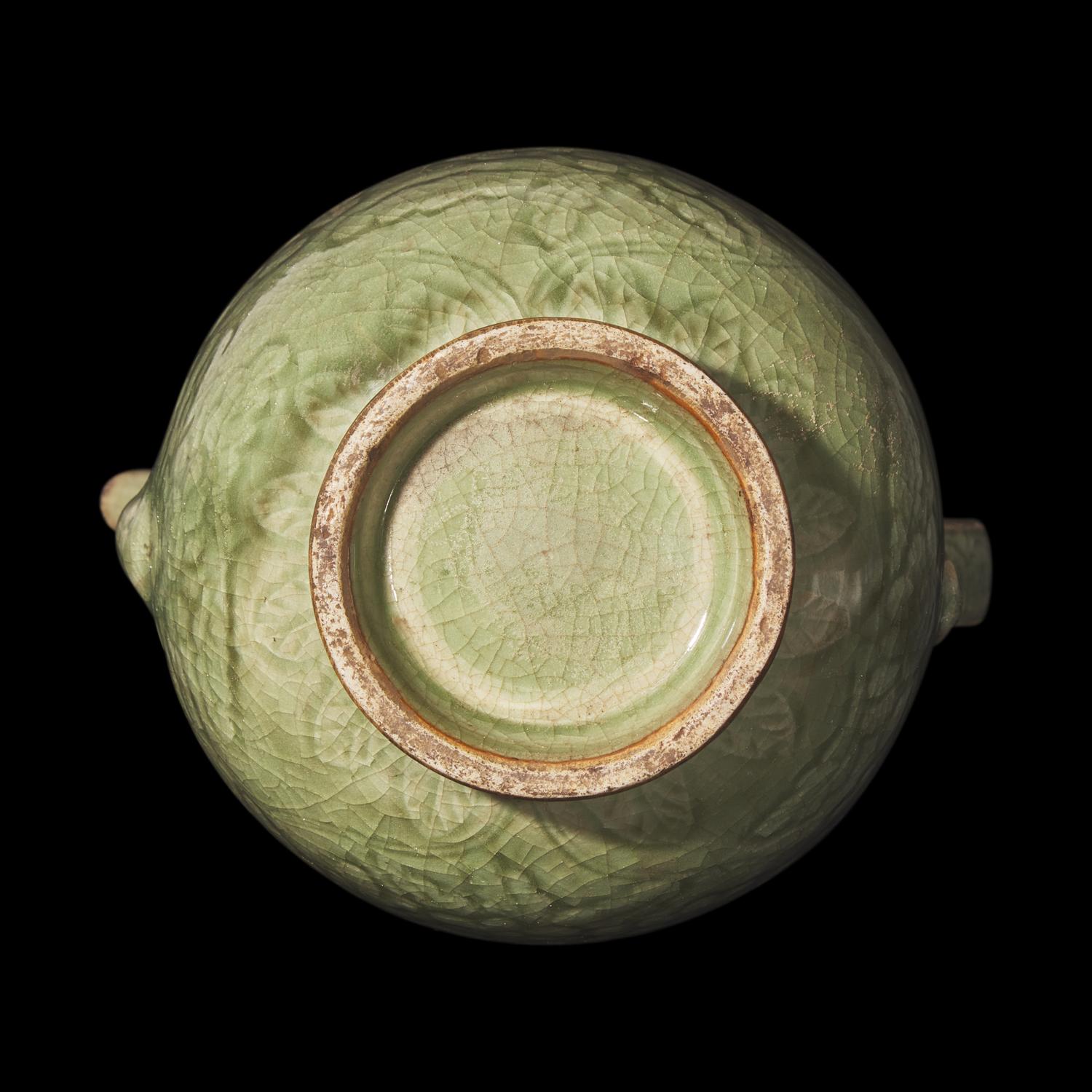 A Chinese Celadon-Glazed Porcelain Ewer, Possibly Ming Dynasty 或為明 青釉刻花執壺