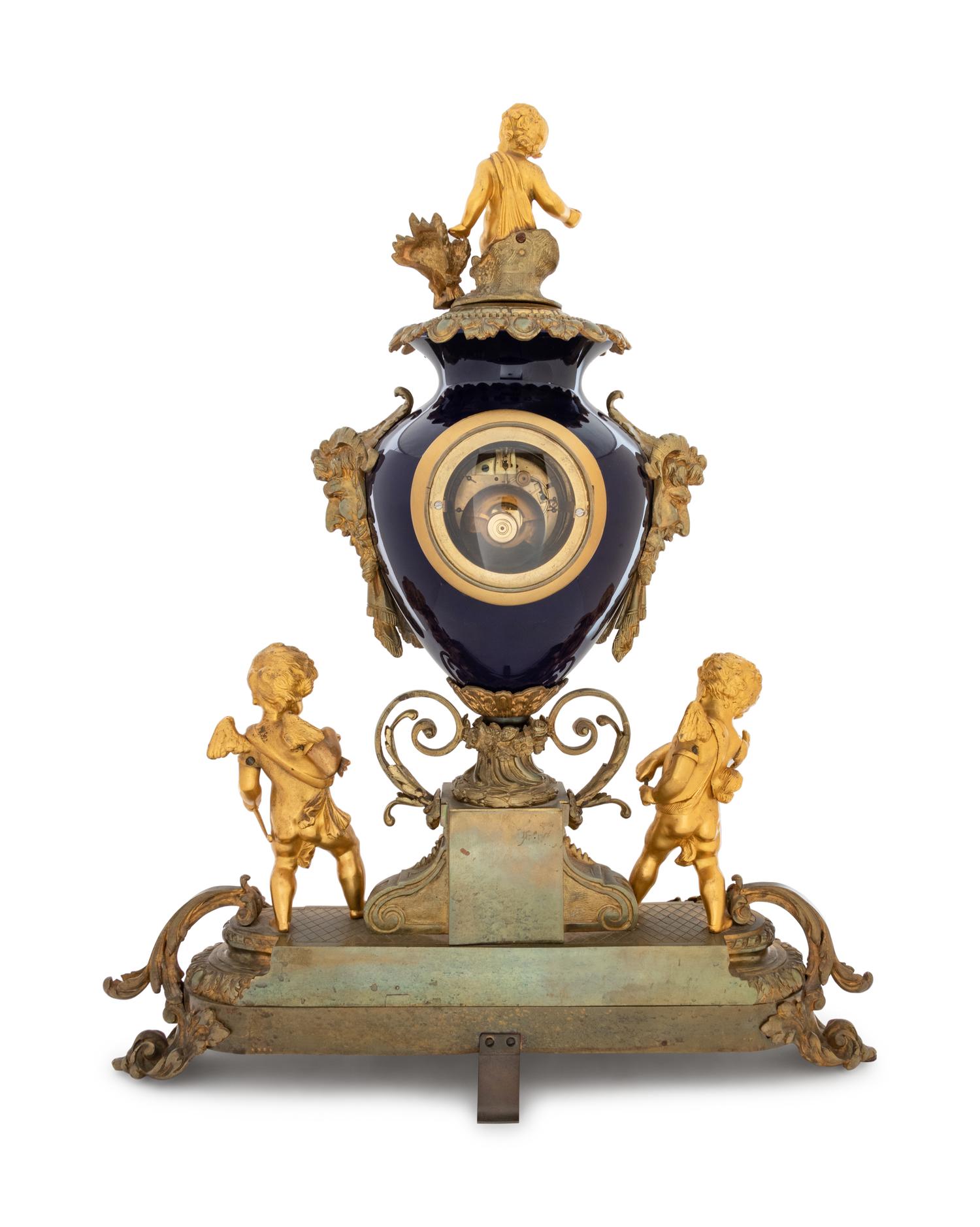 A Sèvres Style Gilt Bronze and Porcelain Mantel Clock