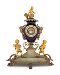 A Sèvres Style Gilt Bronze and Porcelain Mantel Clock