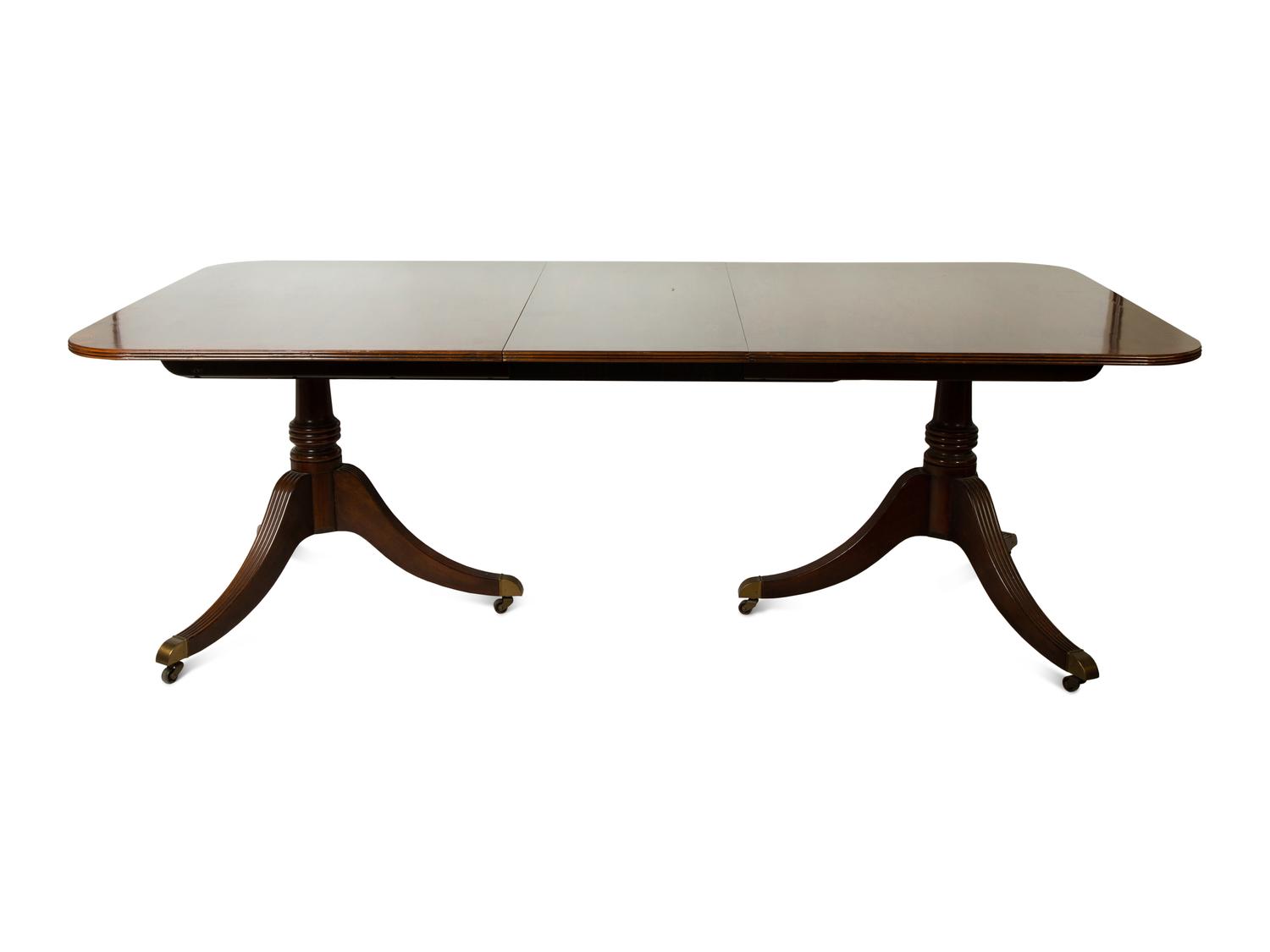A Baker George III Style Mahogany Double-Pedestal Dining Table