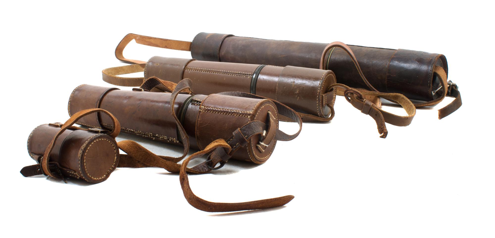 A Group of Four Leather Body Hand Telescopes Length of first 19 inches (when collapsed).