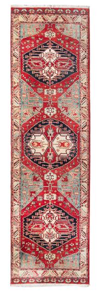A Persian Wool Runner 12 feet 6 inches x 3 feet 6 inches.