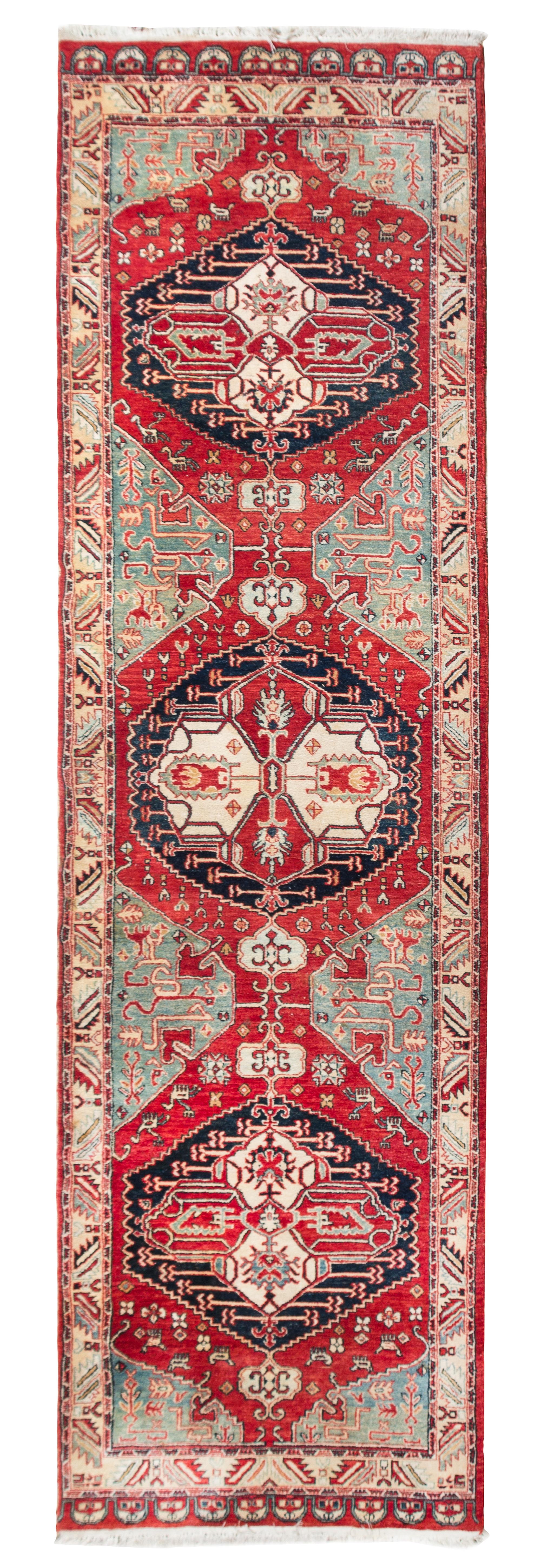 A Persian Wool Runner 12 feet 6 inches x 3 feet 6 inches.
