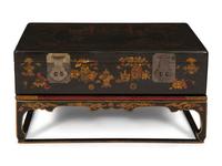 A Chinese Lacquered Trunk on Stand