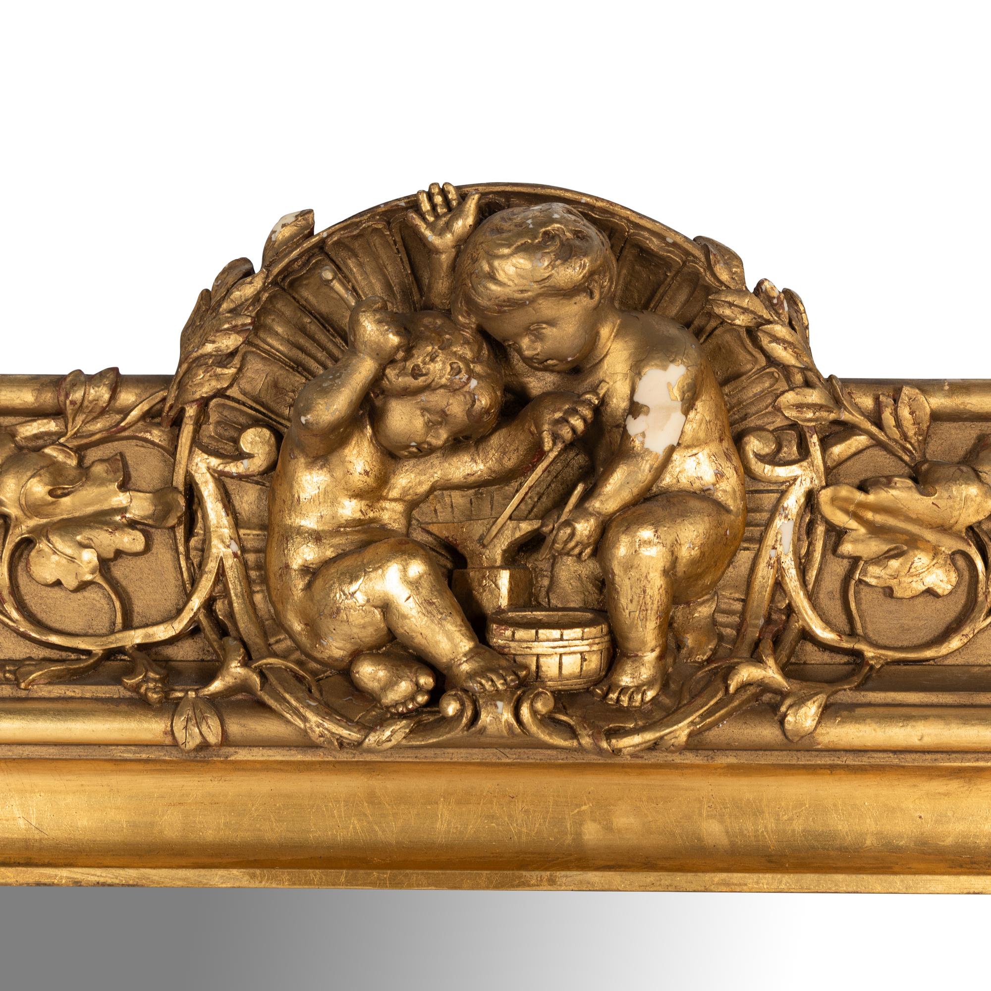 A Baroque Style Carved Giltwood and Gesso Figural Mirror