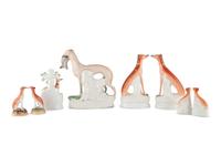 Eight Staffordshire Glazed Earthenware Hounds