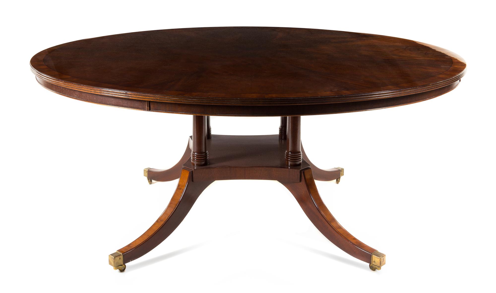 A Regency Style Mahogany Dining Table Height 30 x diameter of top 73 inches. — BEVAN-FUNNELL, 20TH CENTURY