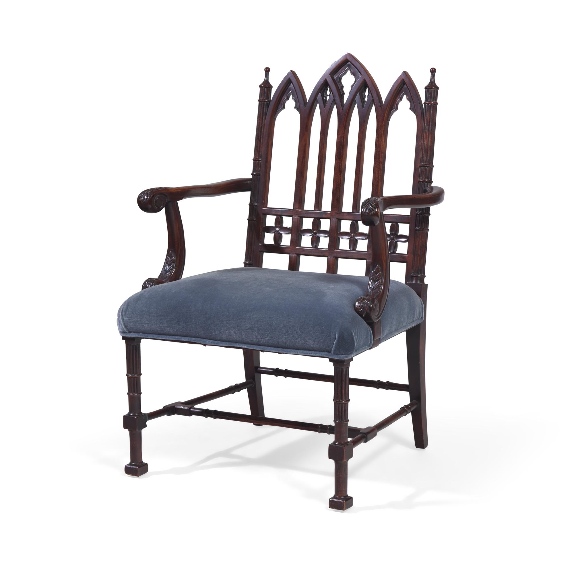 A Gothic Revival Style Carved Oak Armchair