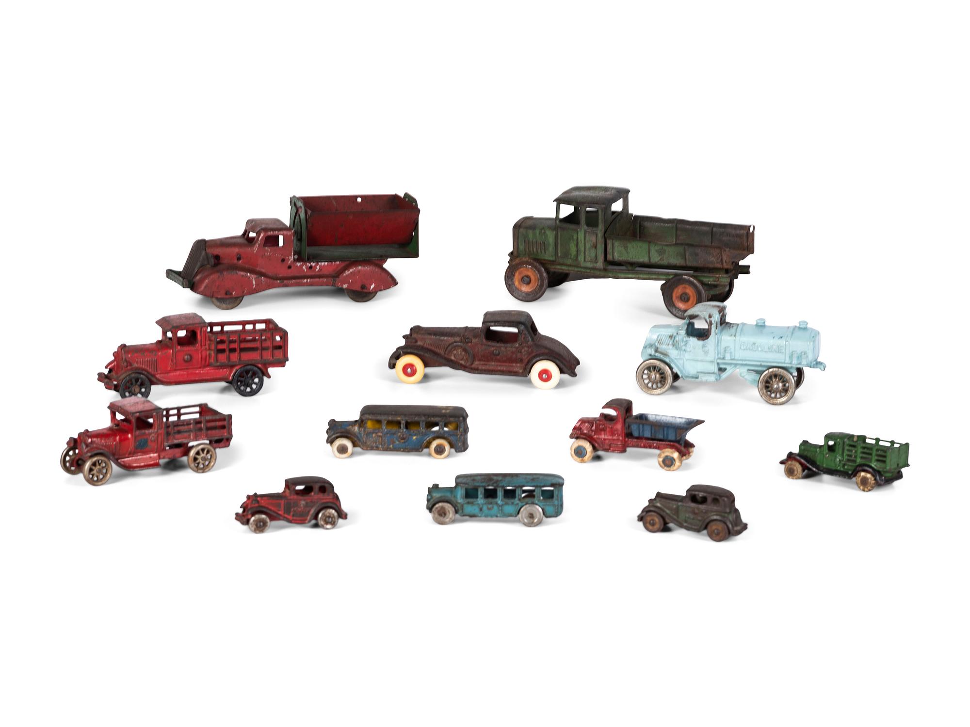 Twelve Painted Cast Iron Cars, Buses, and Trucks