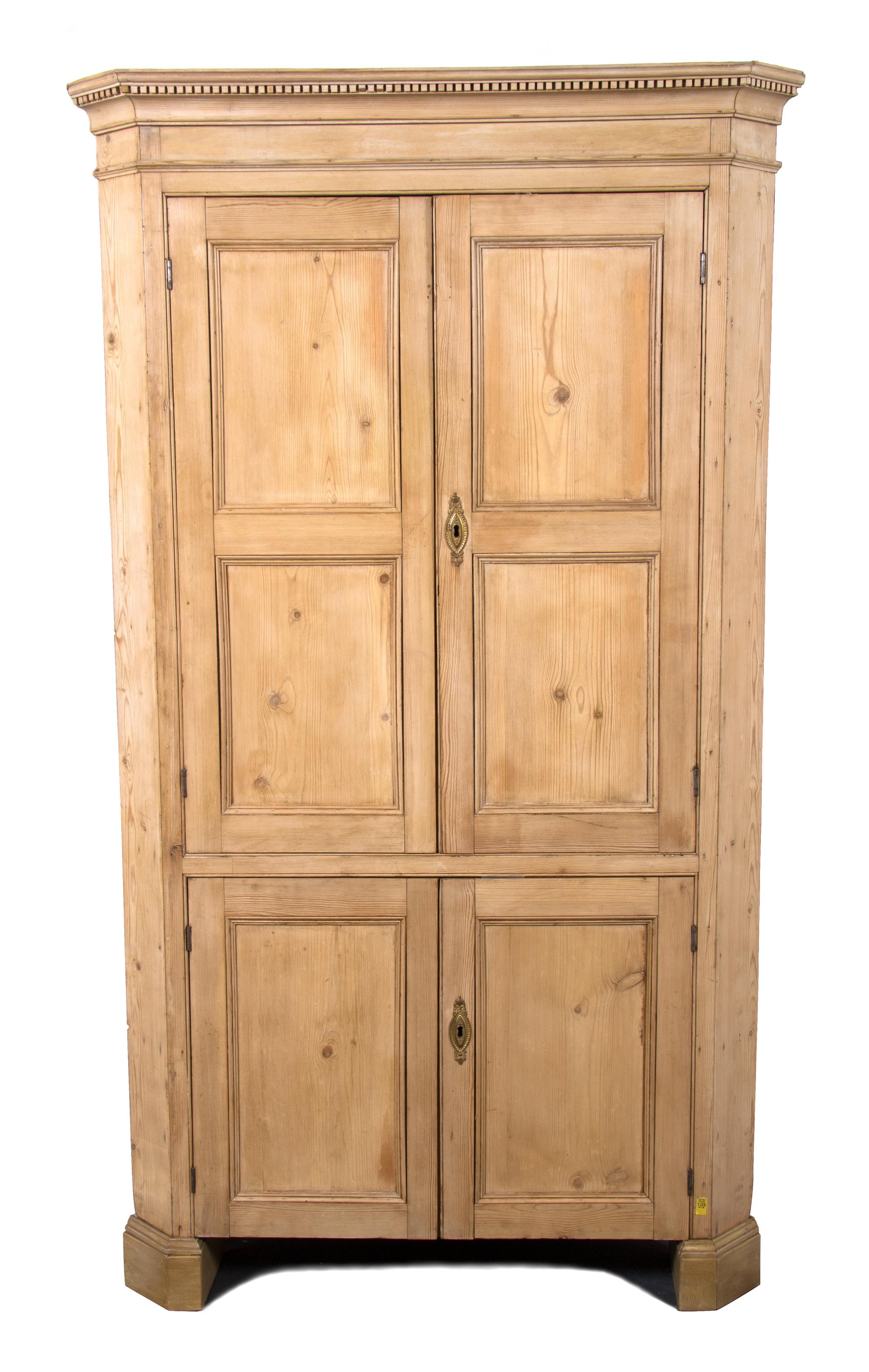 An Irish Pine Corner Cabinet Height 86 x width 48 x depth 28 inches. — 20TH CENTURY