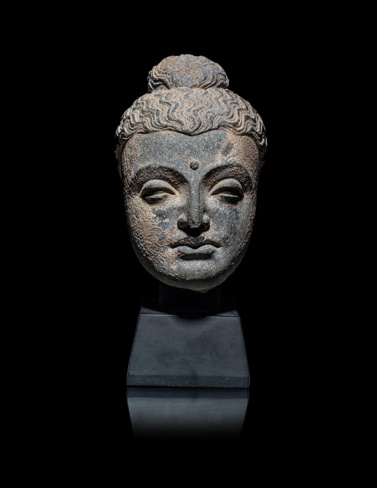 A Gandharan Grey Schist Head of Buddha