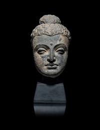 A Gandharan Grey Schist Head of Buddha