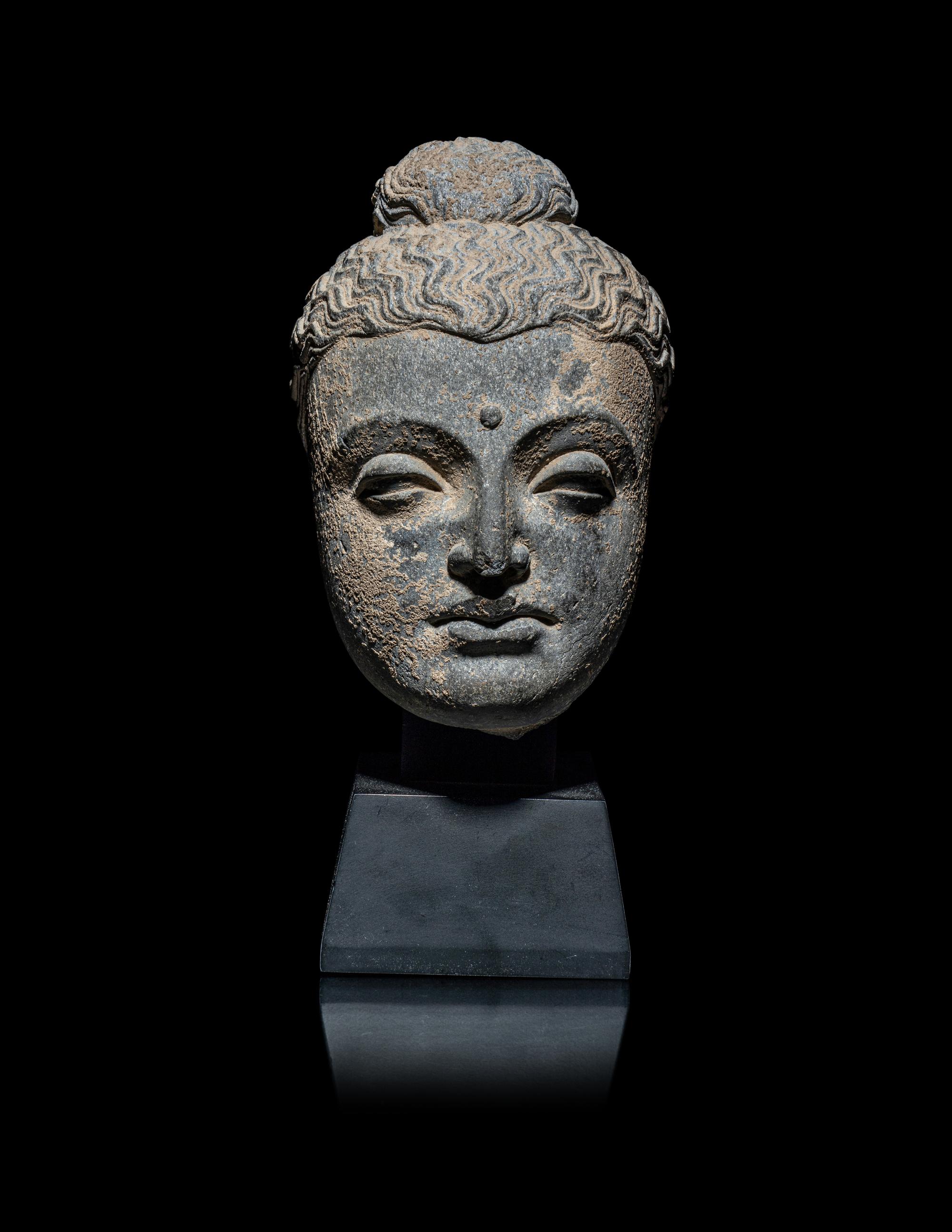 A Gandharan Grey Schist Head of Buddha