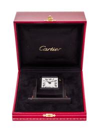 A Cartier Art Deco Style Travel Alarm Clock Height 3 1/2 x width 3 3/8 x depth 1 3/8 inches. — 20TH CENTURY