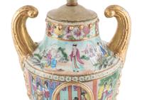 A Chinese Export Parcel Gilt Decorated Famille Rose Porcelain Pistol-Handled Urn