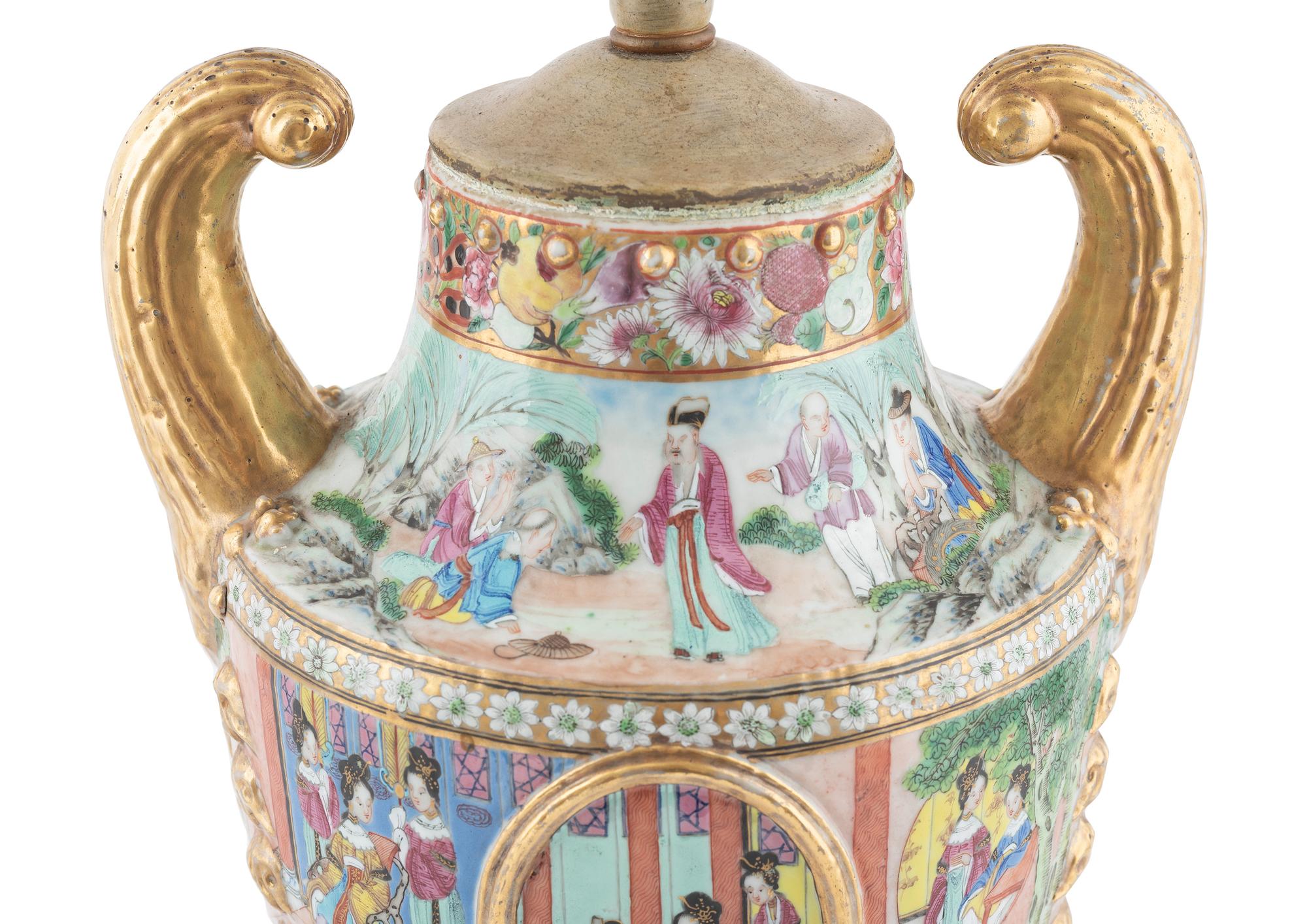 A Chinese Export Parcel Gilt Decorated Famille Rose Porcelain Pistol-Handled Urn