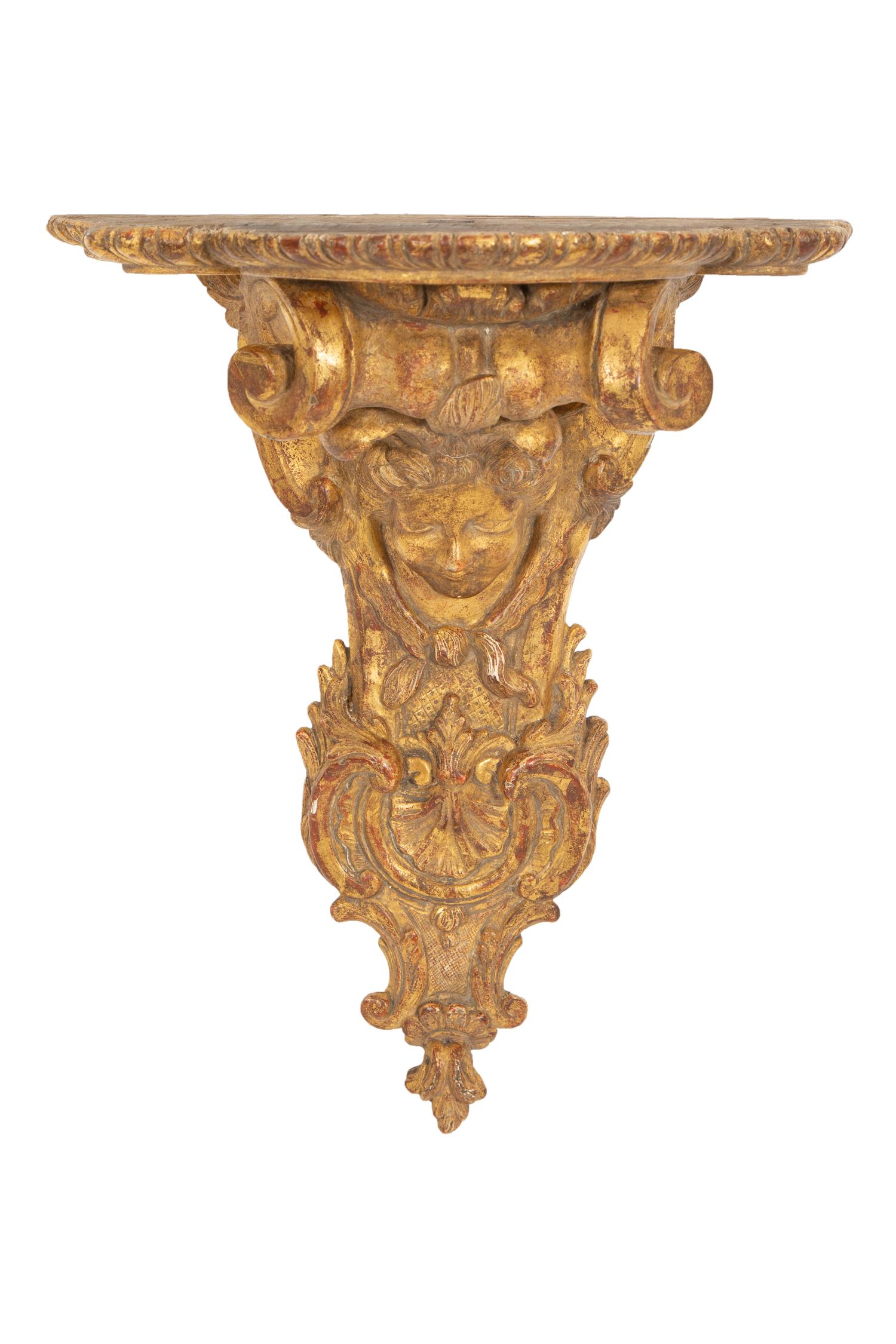 A Pair of Tin-Glazed Earthenware Wall Brackets, and Two Giltwood Wall Brackets