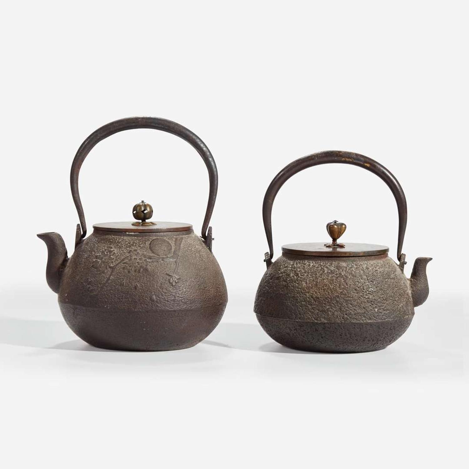 Two Japanese iron tetsubin with patinated bronze covers