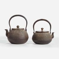 Two Japanese iron tetsubin with patinated bronze covers