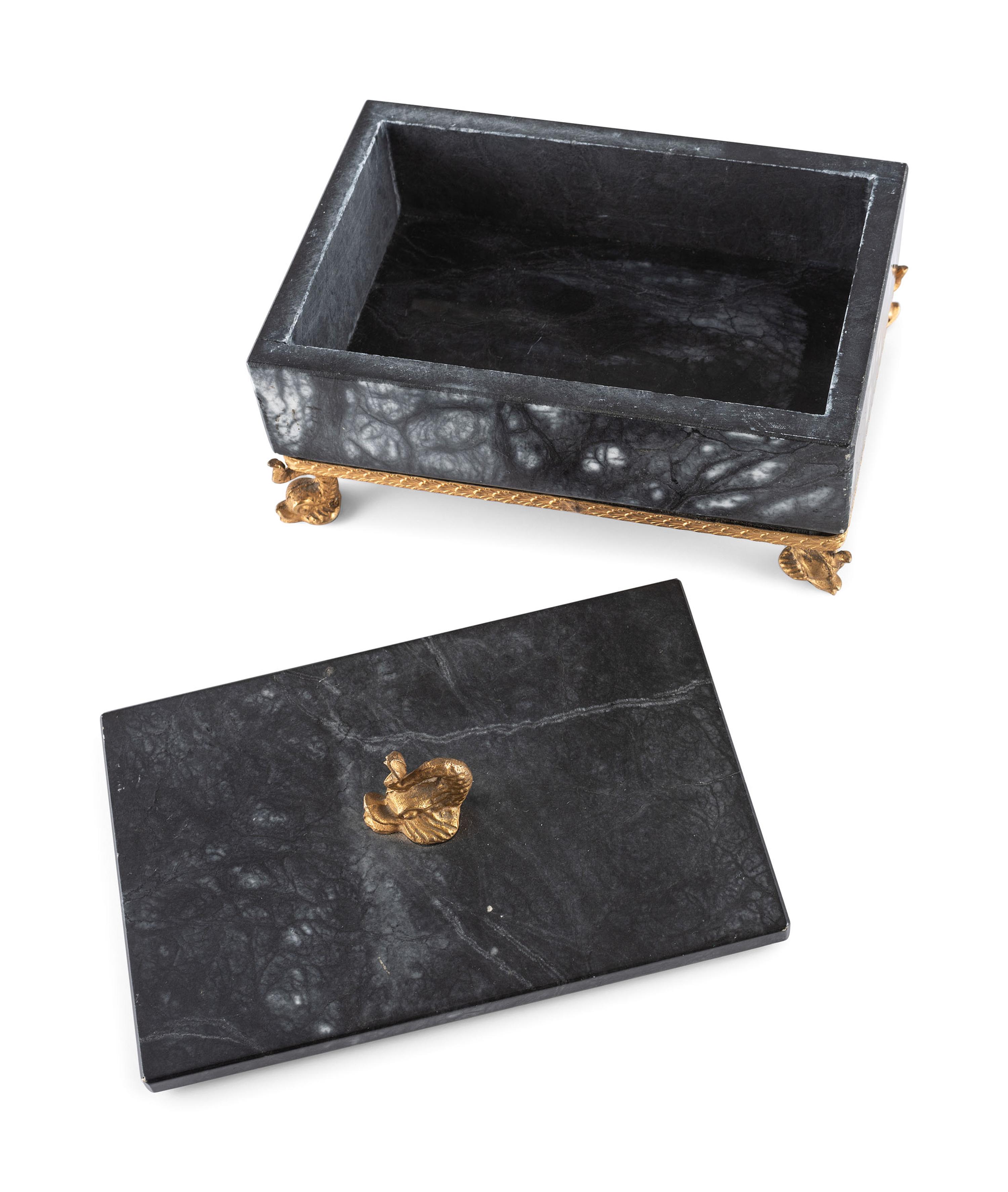 A Gilt and Black Onyx Box with Dolphin Finial