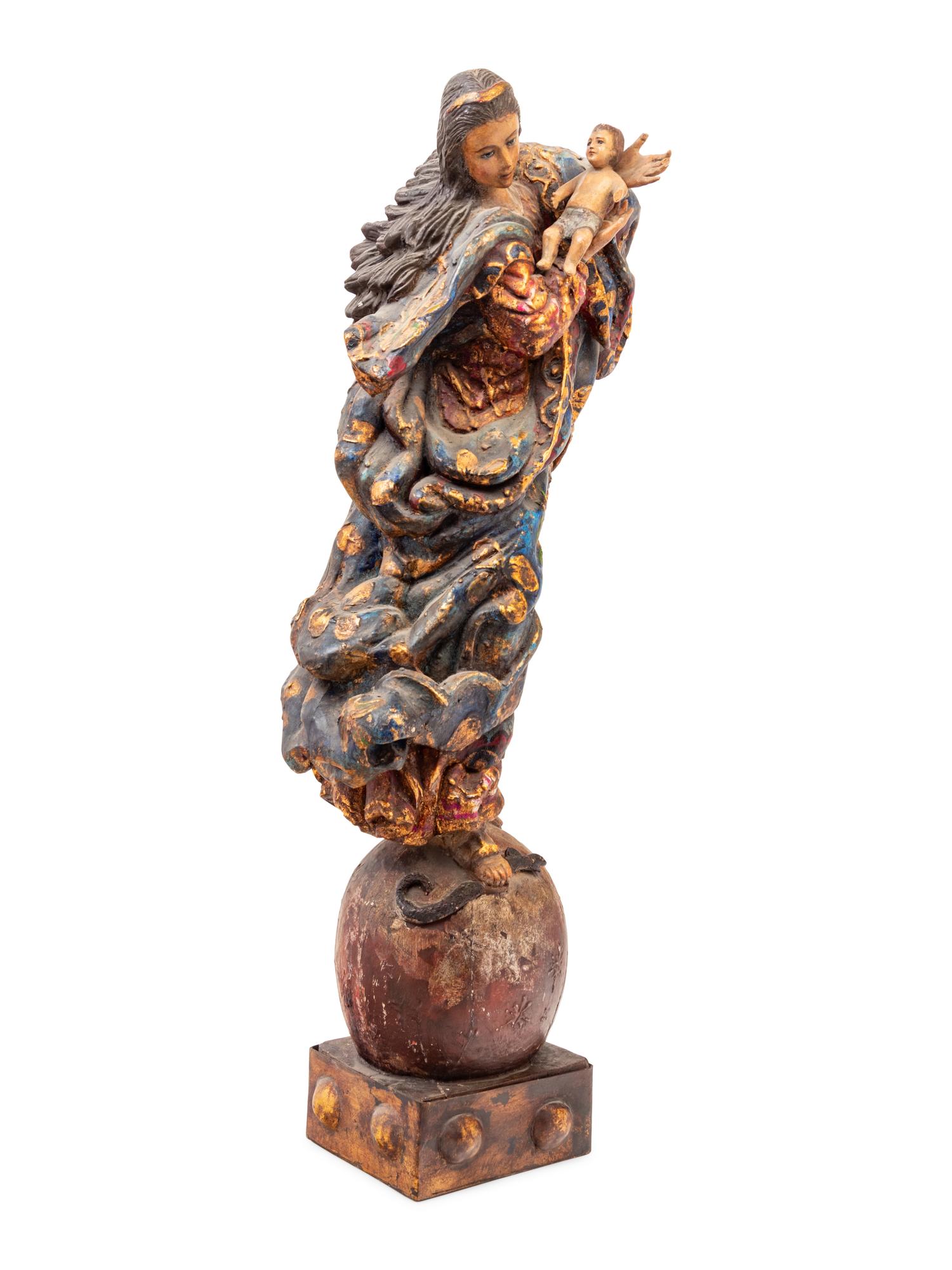 A Continental Carved, Polychromed and Parcel Gilt Figural Group