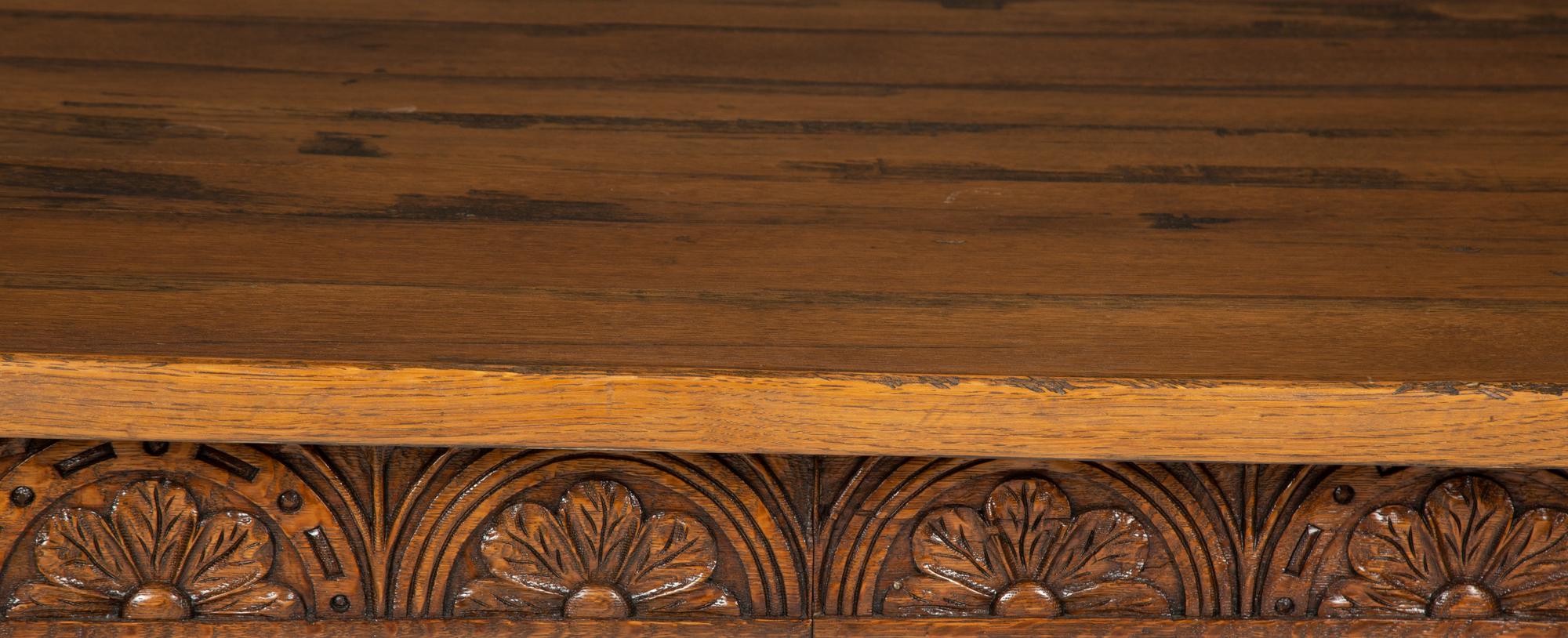 An Arts & Crafts Style Carved Oak Refectory Table