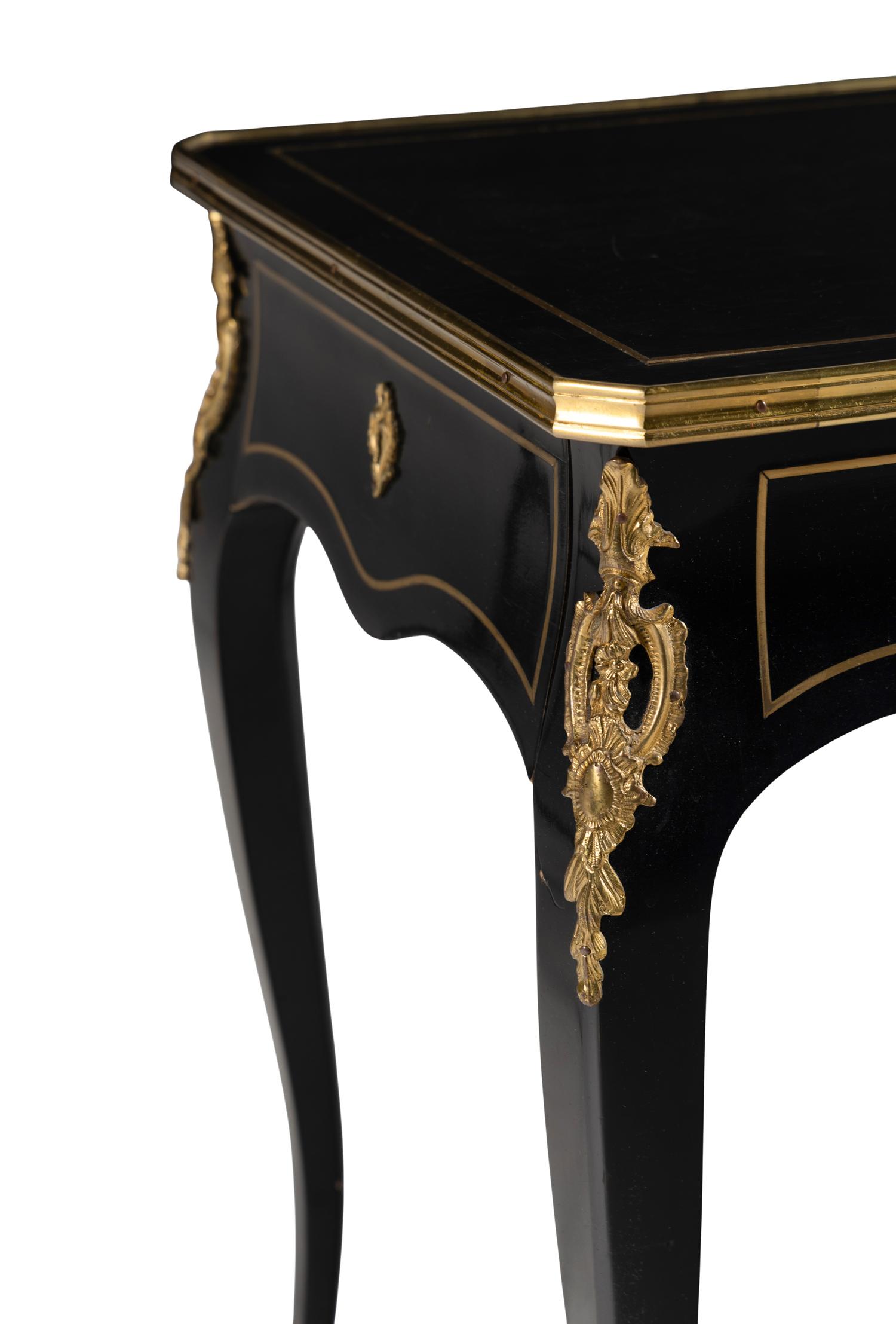 A Napoleon III Style Gilt Bronze Mounted Ebonized Table