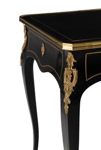 A Napoleon III Style Gilt Bronze Mounted Ebonized Table