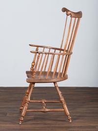 A Volute and Scroll Carved and Reel Turned Windsor Armchair