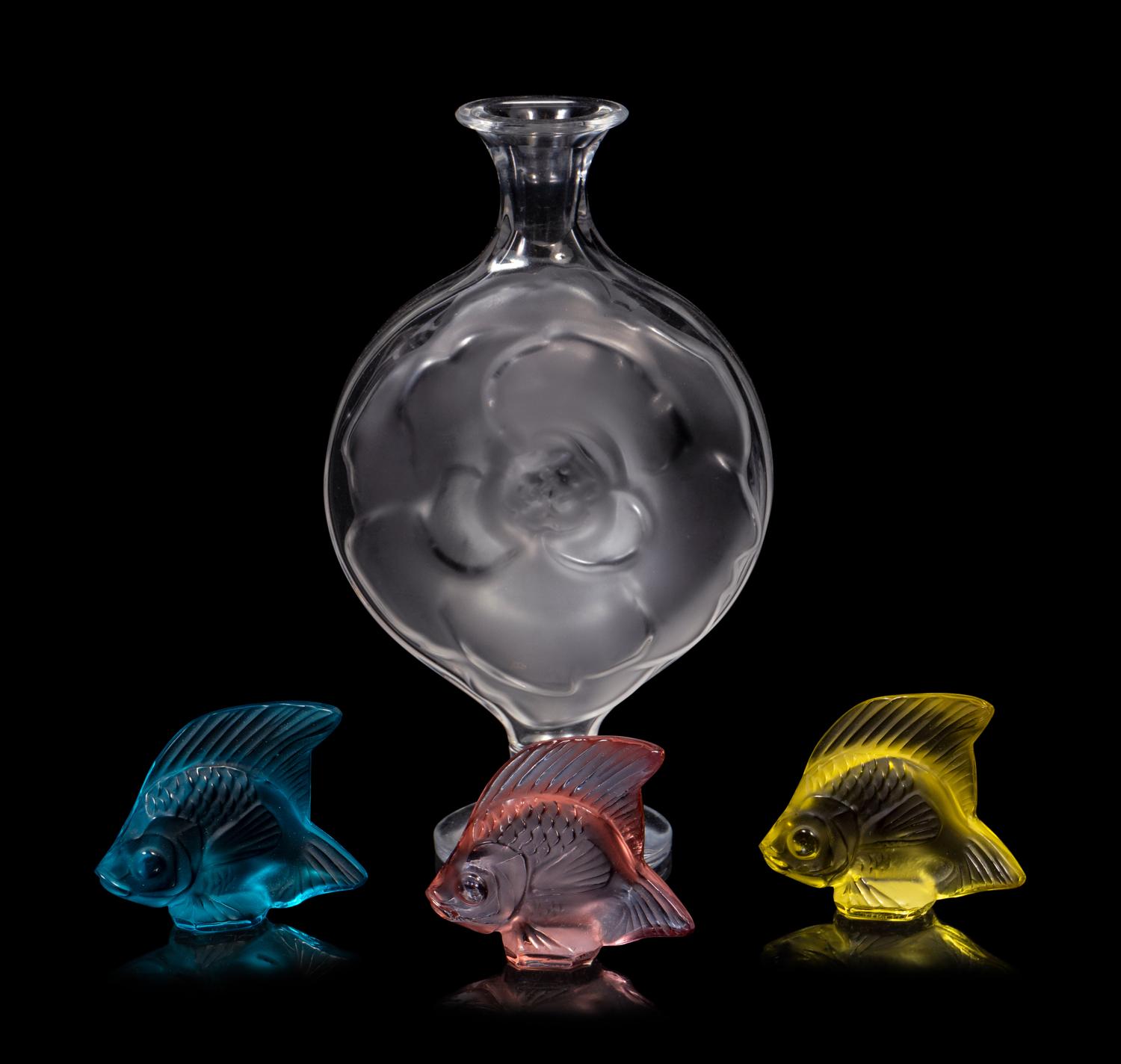 A Lalique Perfume Bottle and Three Lalique Fish