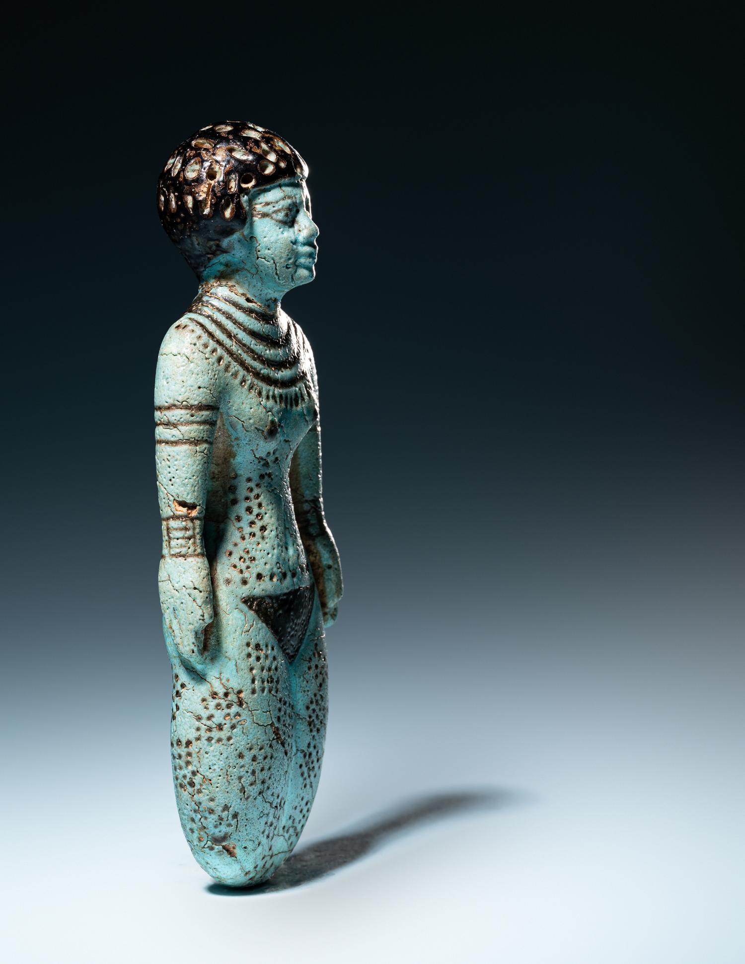 An Egyptian Faience Female Figure