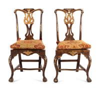 A Pair of Portuguese Parcel-Gilt and Carved Walnut Side Chairs