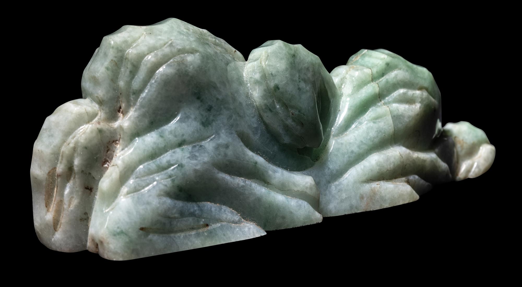 A Chinese Apple Green and Pale Celadon Jadeite Mountain-Form Brush Rest, Bijia