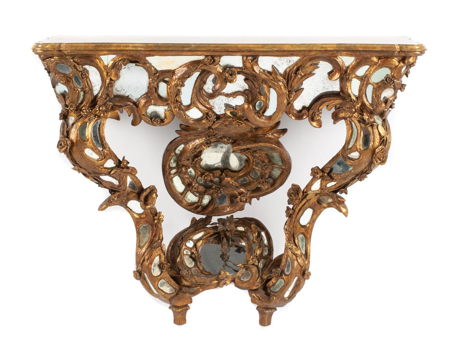 A Venetian Mirror-Inset Giltwood Console Table Height 34 x width 44 x depth 16 1/2 inches.